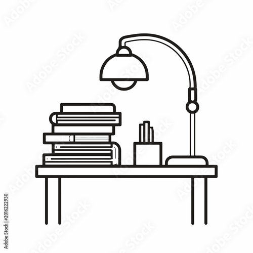 Desk lamp on a desk with books.