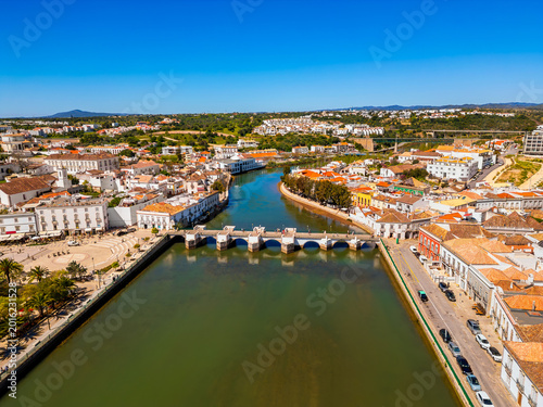 High angle Drone Point of View on the Old Town of Tavira, Algarve, Portugal with the Gilão River and the famous Ponte Romana Medieval Roman Bridge