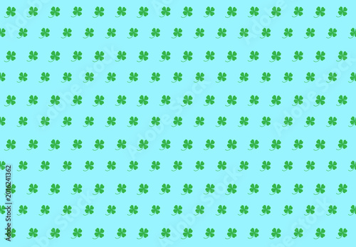 Fotografie Green clover leaves on a Cadet Blue background for the background