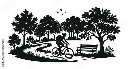 Cyclist riding a bicycle in a park landscape silhouette