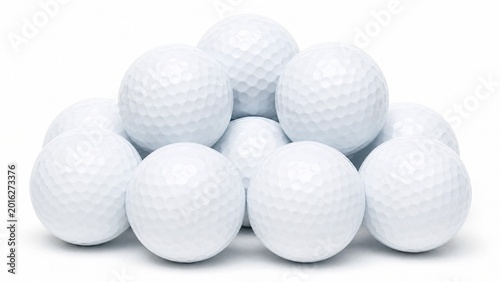 Close-up of a cluster of golf balls, highlighting their pristine white surface and unique dimple texture.