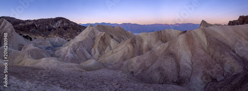 Silent pre-dawn landscape of Death Valley badlands.