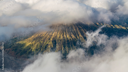 Obraz na plátně Gn.Batok Surrounded by clouds,aerial view