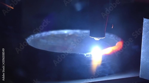 Slow motion clip of a high-tech additive manufacturing The slow-motion video footage showcases the additive manufacturing process through robotic-controlled welding.