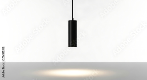 A contemporary black cylindrical pendant lamp provides focused illumination while suspended against a clean white background, perfect for architectural lighting concepts