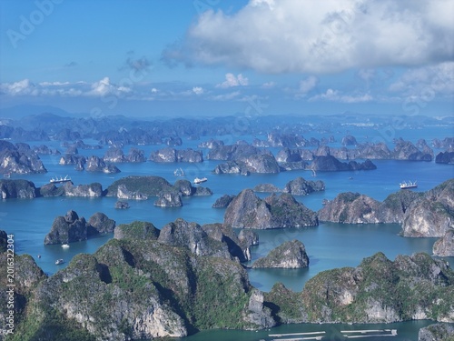 Aerial View of Boats Navigating Through Karst Islands in Tropical Sea