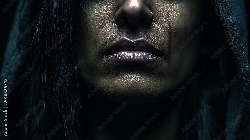 Fototapeta premium Close-up of a person's face in the rain with visible sweat or water droplets