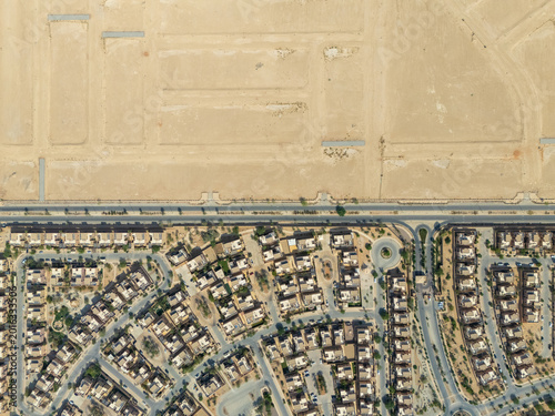 Obraz na płótnie Aerial View of Residential Houses and Desert Urban Area in Modern Saudi Arabia D