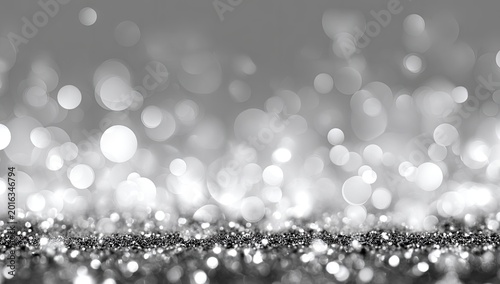 Sparkling Silver Glitter Bokeh Background with Soft Focus Lights.