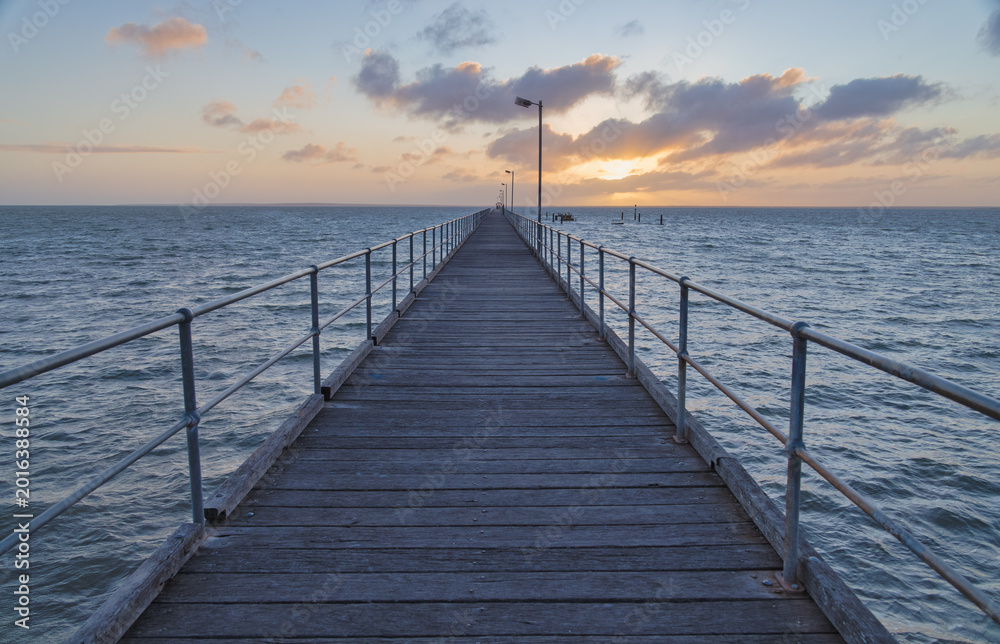Fototapeta premium Wooden Pier Overlooking the Water at Sunset in Ceduna, Australia