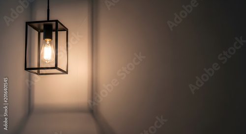 Elegant hanging lantern a warm glow against a neutral wall