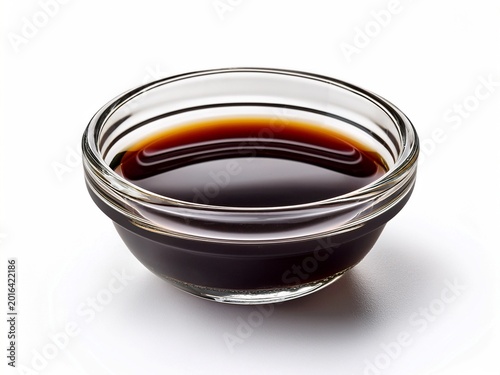 soy sauce in small glass bowl isolated on white background. dip