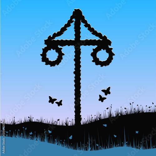 A traditional Maypole in silhouette with flying butterflies. Swedish midsummer. 
