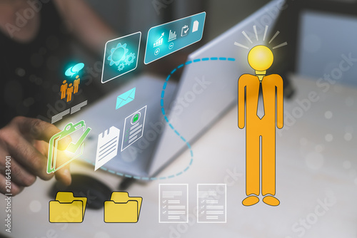 Man developing business ideas using artificial intelligence technology, classifying documentation, data forms, and company statistics on a laptop at home. Concept of business ideas and enterprise for 