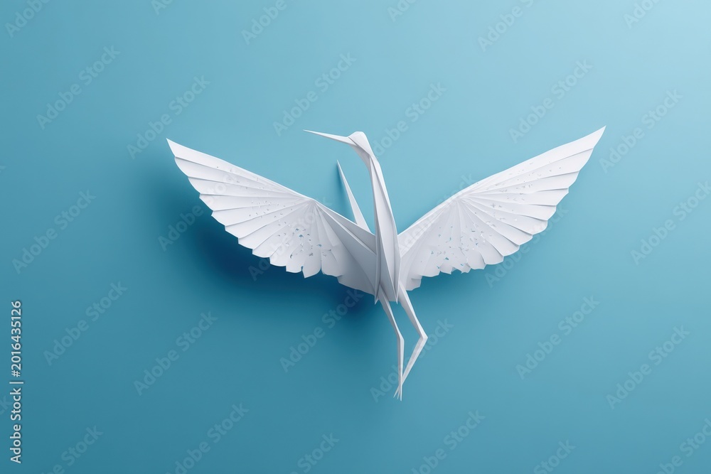 Fototapeta premium Elegant White Origami Crane Bird Spreading Wings in Flight Against a Soft Blue Background