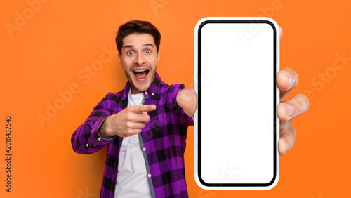 Canvas Print A person in a purple and black checkered shirt stands in front of an orange wall