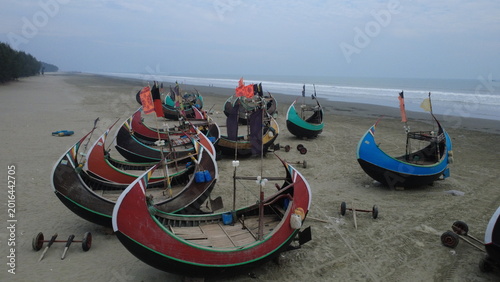Traditional Wooden Fishermen's fishing boat, Teknaf Coxs bazar, Bangladesh. Colorful Wooden Fishing Boat On a Cox's Bazar Sea Beach With Sunny Day Background in Bangladesh. Beautiful Bangladesh Photo.