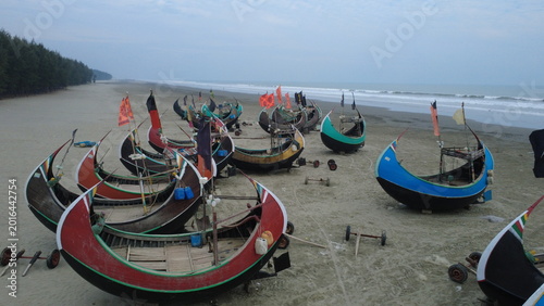 Traditional Wooden Fishermen's fishing boat, Teknaf Coxs bazar, Bangladesh. Colorful Wooden Fishing Boat On a Cox's Bazar Sea Beach With Sunny Day Background in Bangladesh. Beautiful Bangladesh Photo.