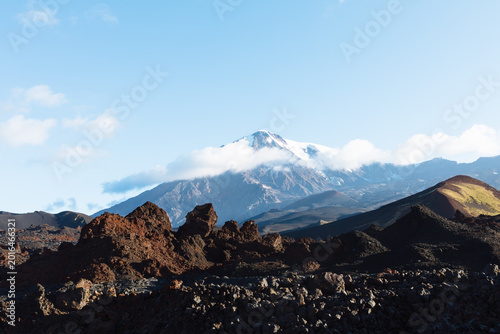 Obraz na plátně Wide view of Tolbachinsky Dol lava fields and cinder cones with the snowcapped K