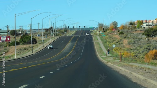 The multi-lane highway in Arizona, featuring traffic lights hanging from horizontal poles over the asphalt.