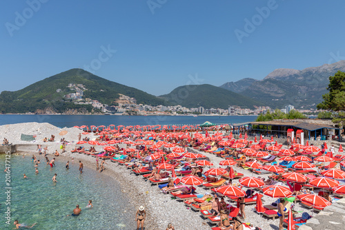 Bild auf Leinwand Summer beach scene on Sveti Nikola Island near Budva, Montenegro, with crowds of
