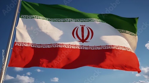 Waving Iranian Flag Against Blue Sky - The national flag of Iran is prominently displayed, waving gently against a bright blue sky dotted with white clouds.
