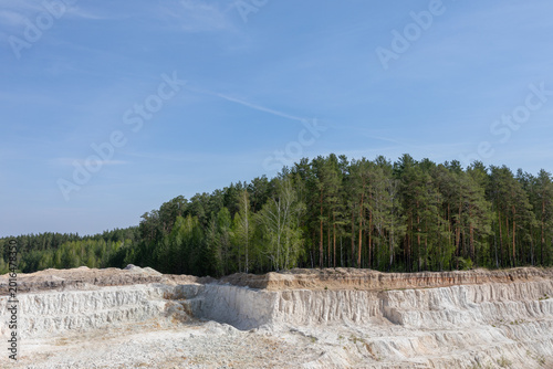 фотографія Wide landscape view of the Ural Bali kaolin quarry with bright white clay terrac