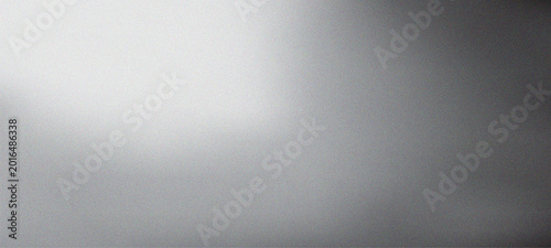 Abstract film grain texture background with soft white light leak and vintage cinematic noise for overlay or backdrop