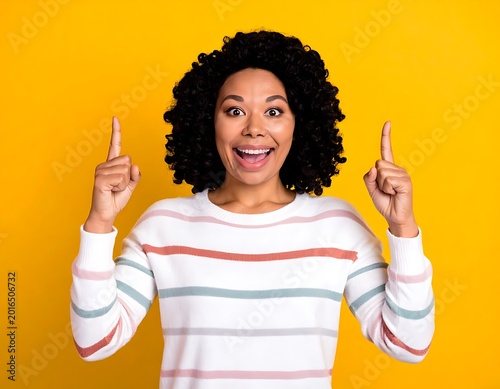 A woman points upwards with a surprised expression