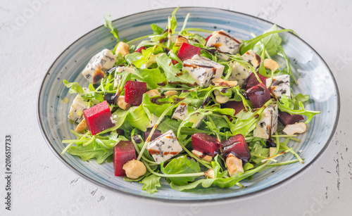 Beetroot arugula salad with blue cheese nuts and balsamic glaze