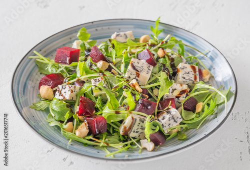 Beetroot arugula salad with blue cheese nuts and balsamic glaze