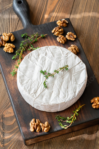 Camembert Cheese Garnished With Fresh Thyme And Walnuts Rustic Gourmet Presentation