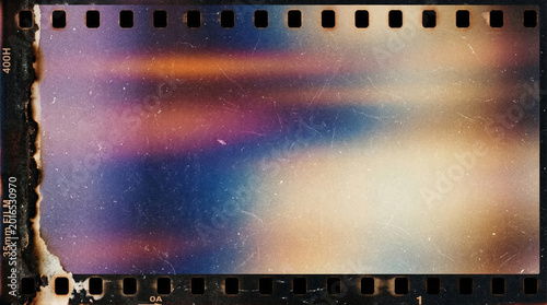 Vintage 35mm film strip with colorful light leak exposure effect in purple blue orange and beige tones