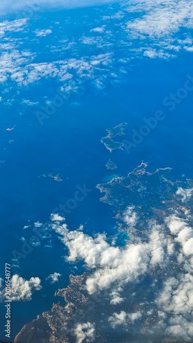 Vertical aerial view of Mediterranean islands surrounded by deep blue sea
