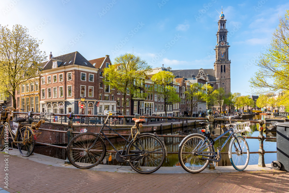 Fototapeta premium Amsterdam canals and Westertoren tower in Jordaan district, Netherlands
