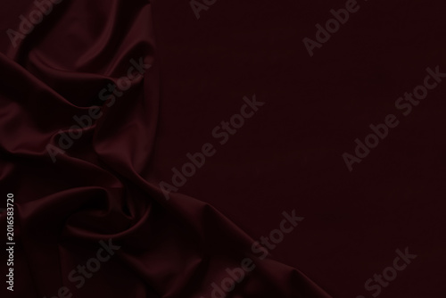 Black dark burgundy red silk fabric with elegant drapery folds, luxury satin textile background, rich crimson velvet style abstract backdrop. Festive. Empty template design ad.Top view table, flat lay