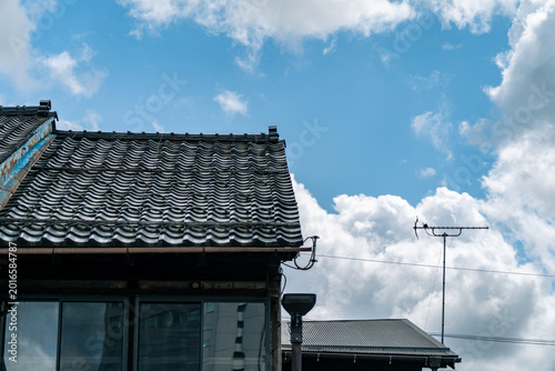 Photography Traditional Japanese House Roof Under Bright Blue Sky and Clouds