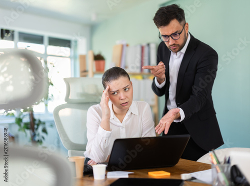 Tableau sur toile Male manager is dissatisfied with the work of an employee - yells and reproaches