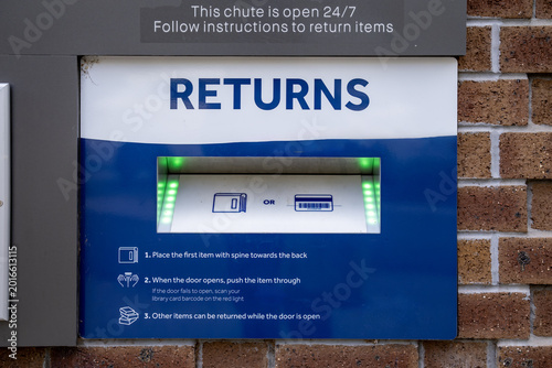 Obraz na plátně A 24/7 automated book return chute outside a public library in Melbourne, Australia featuring step-by-step instructions for returning library items