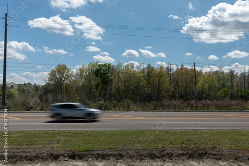 Photos car blurring through landscape