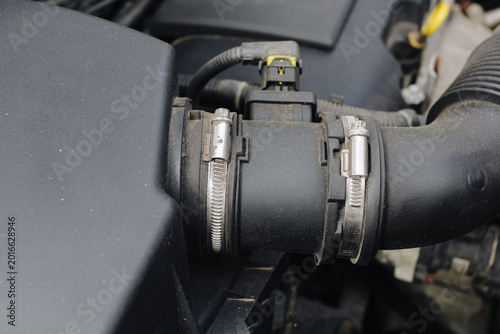 Photos Air intake sensor and hose in car engine close up