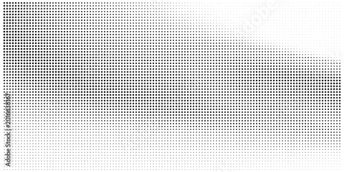 Dynamic halftone dot gradient pattern with diagonal fade in monochrome abstract background, pop art