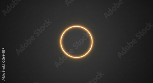 Glowing gold ring with shimmering particles against a black background.