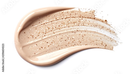 Beige foundation smear with gold glitter.  A light beige foundation is swirled and smeared across a white background,  sprinkled with tiny gold glitter particles