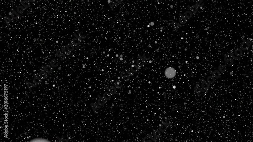 A dark background featuring glowing white particles and soft bokeh light effects