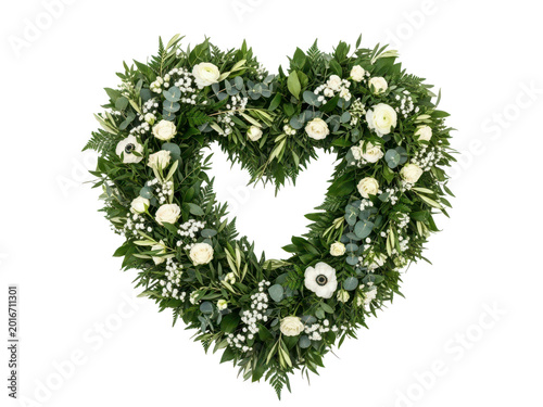 Heart shaped christmas wreath with white flowers and greenery