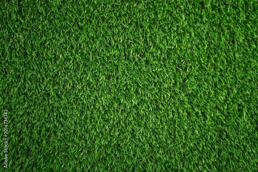 Fototapeta premium Artificial green grass texture background for sports field