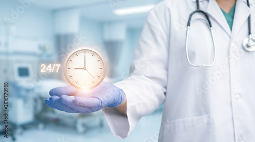 Doctor holding 24/7 clock icon, symbolizing emergency care, medical support, healthcare service, and patient access.