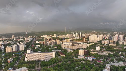 A drone view of the central part of Almaty, Kazakhstan, during sunset on a spring evening.