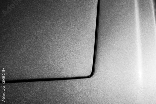 Valokuva Black and white close-up of a modern car's panel gap, matte bodywork and a preci